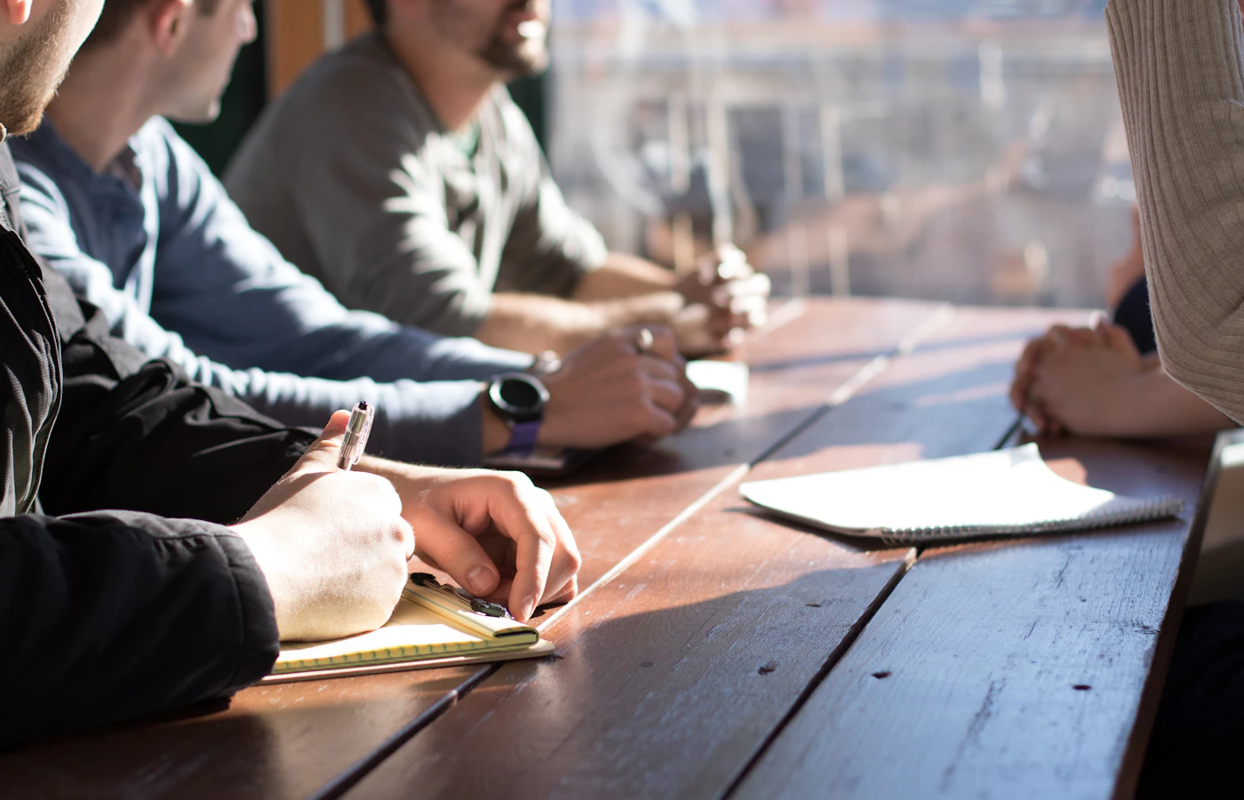 Participants sharing ideas around a meeting table